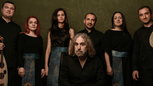 The Naghash Ensemble by David Galstyan Six people standing together with one man sitting in front