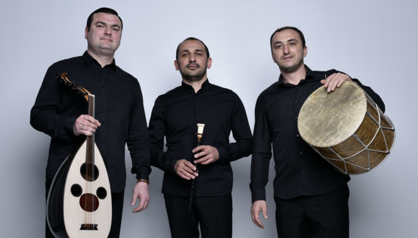 Three men standing with traditional Armenian instruments