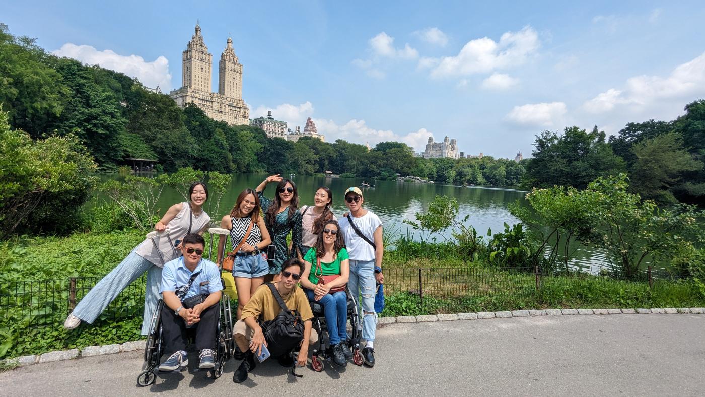 A group poses for a photo in Central Park, NYC