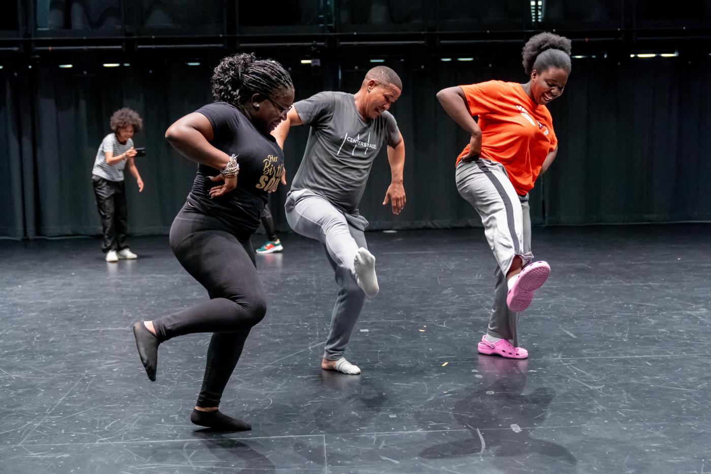 Four people dancing together