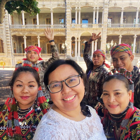 Five people, 4 in traditional Tboli clothes, posing together